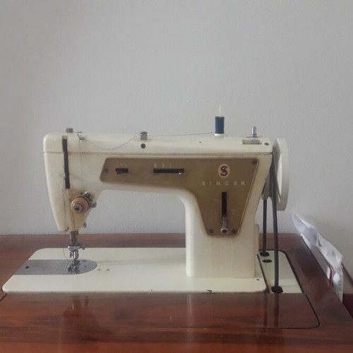 Singer sewing machine refurbished, foot-operated with cabinet