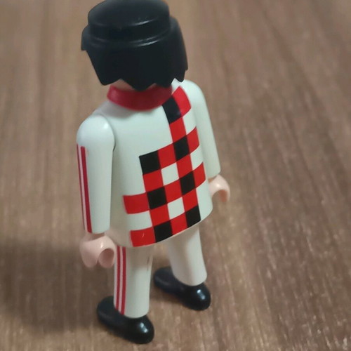 Playmobil figure with white outfit and checkered pattern like new