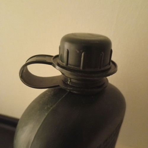 Plastic military canteen with case used