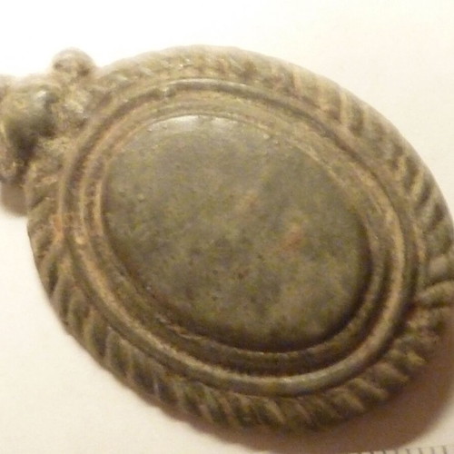 Antique bronze applique from horse harness used