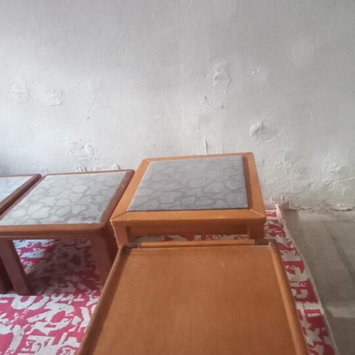 Wooden side tables with plastic protection and decorative fabric