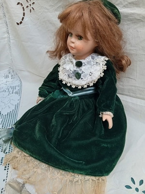 porcelain doll with green velvet dress Vintage Porcelain Doll Green Velvet Dress Blonde Hair Girl