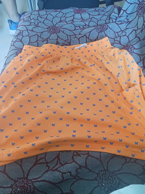Mini skirt used orange with blue butterflies for girls 14-15 years