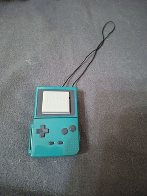 Vintage Battpoke Tomy game like GameBoy Color with ball and Pikatsu caps like new