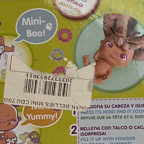 The Bellies Mini Yummy doll used, pink hair, orange bows