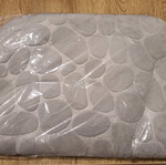 Bath mat unused in plastic wrap