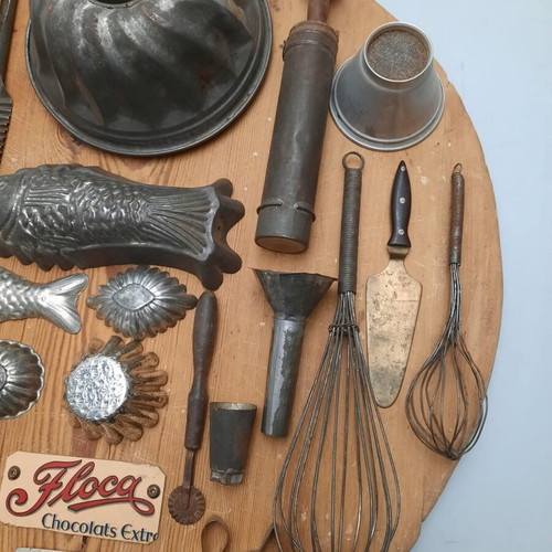 Collection of vintage pastry tools on wooden board
