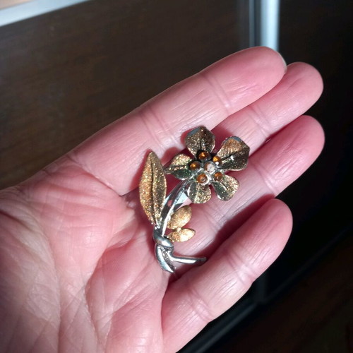 Flower pin used, orange and gold colors