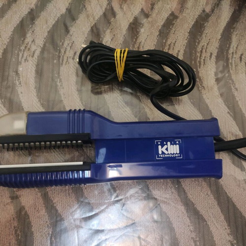 KLM VapoStir Steam Straightener used with steam function