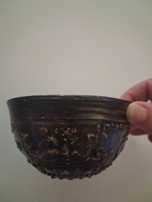 Replica vessel with embossed erotic scenes from Pella Museum, used