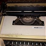  Vintage γραφομηχανή Olivetti Dora made in Barcelona, δεκαετίας 1960, με τη δερμάτινη θήκη-βαλίτσα. Τιμή 119 ευρώ.