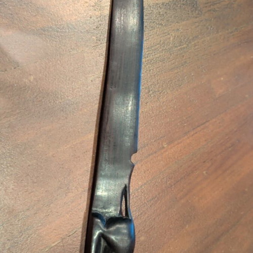 Wooden paper cutter used with handmade African art carving