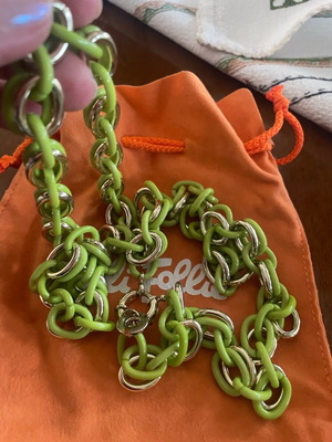 Folli Follie acrylic necklace like new with metallic green and gold details