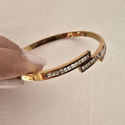 Steel bracelet in rose gold color with decorative stones, like new