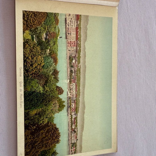 Leather-bound book with used Swiss Geneva postcard images