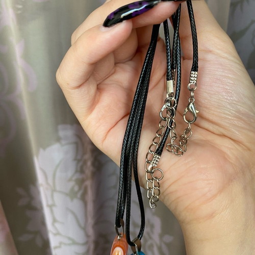 Pack of two crystal necklaces new with black cord unisex