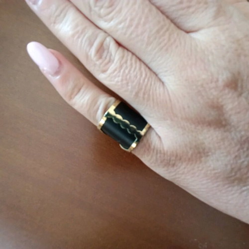 Ring like new, black and gold, for pinky finger