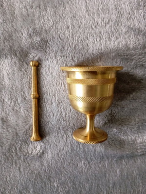 Decorative mortar and pestle in golden tone like new