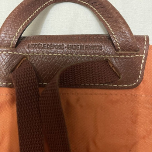 Longchamp Le Pliage backpack used, orange