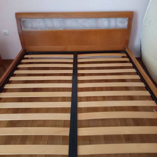 Double bed with decorated beech wood headboard