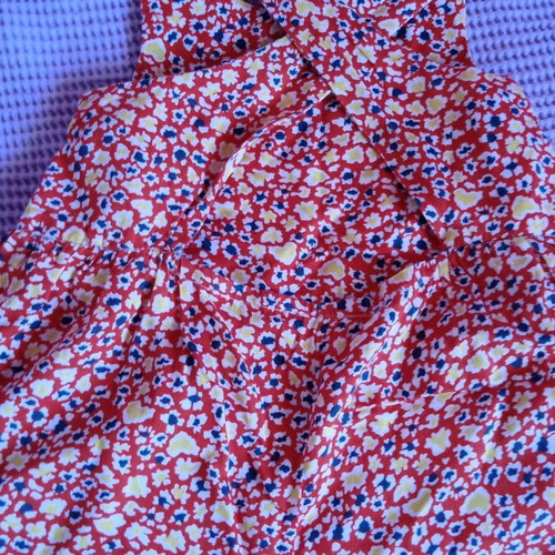 Red salopette with patterns for 3 years like new