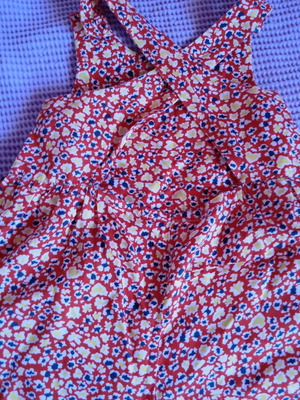 Red salopette with patterns for 3 years like new