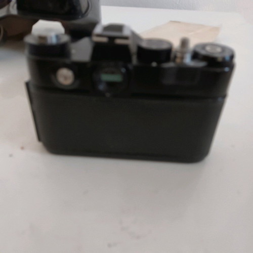Zenit EM camera used with Helios 44M 2/58 lens and leather case