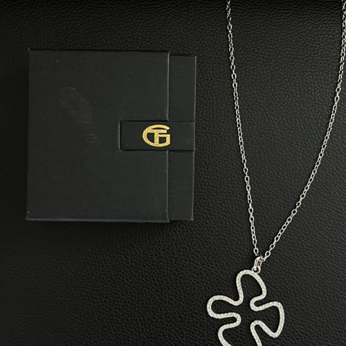 Necklace with metal and rhinestone pendant