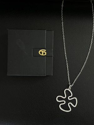 Necklace with metal and rhinestone pendant
