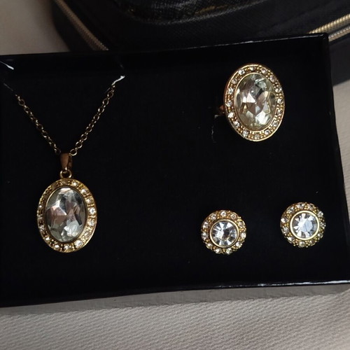 Avon jewelry set with gold color, rhinestones and stones, steel