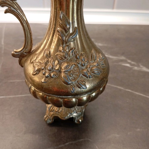 Metal container used with embossed design and handle