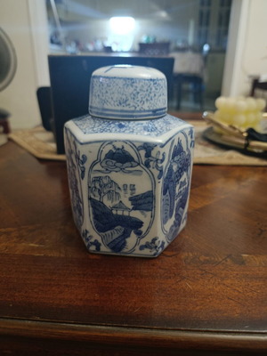 Hexagonal decorative vase with scenes