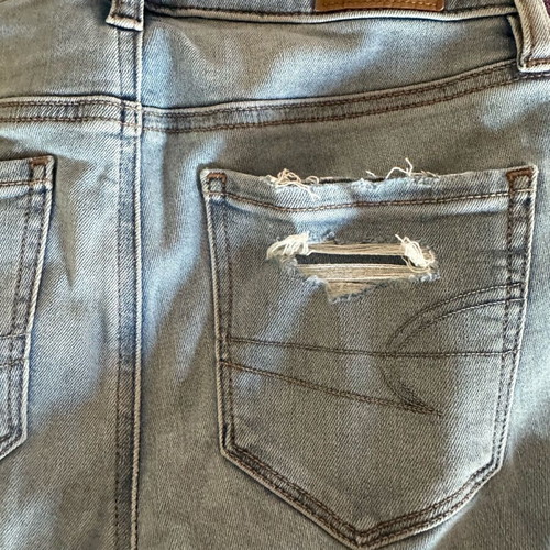 American Eagle stretch jean with rips new size S