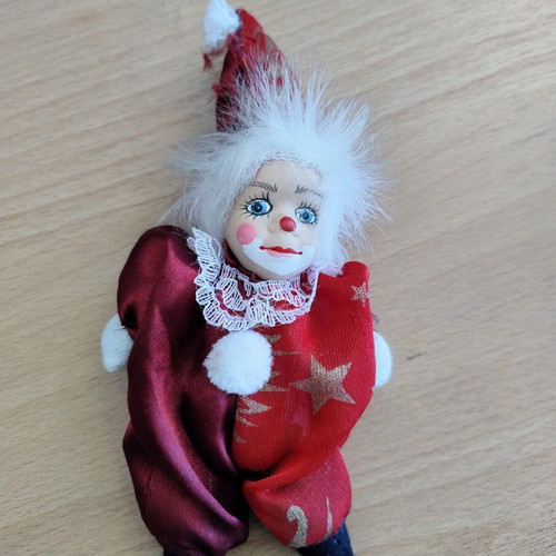 Decorative clown doll with movable head, used