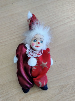 Decorative clown doll with movable head, used