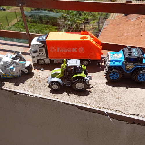 Lot of 4 used medium-sized children's toy vehicles