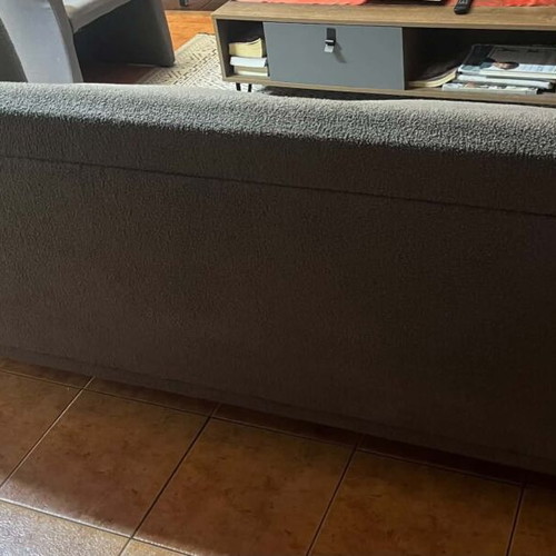 Two-seater sofa gray like new with wooden legs and recliner gift