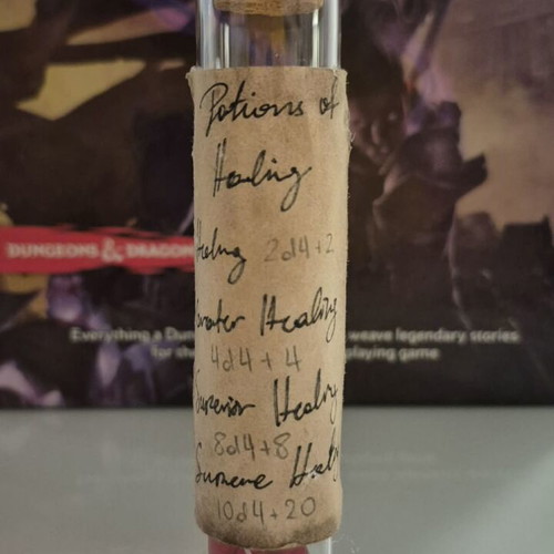 DnD healing potion bottle with 10 red tetrahedral dice