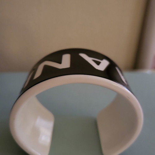 Cuff bracelet like new, black resin with white letters