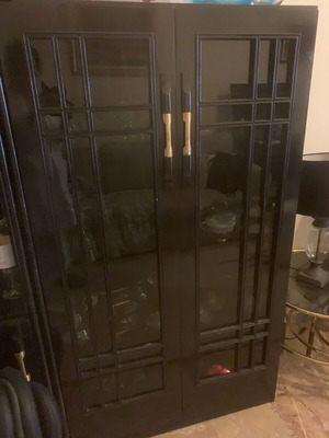 Solid wood showcase used, black lacquer with lighting