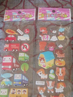 Set of 2 sticker packs with dogs and vehicles, multicolored