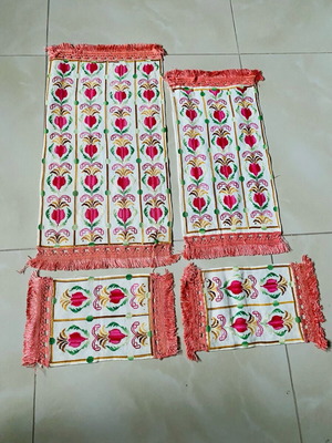 Set of embroidered handmade table linens used
