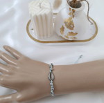 Macrame bracelet with stainless steel shell and beads, turquoise and silver