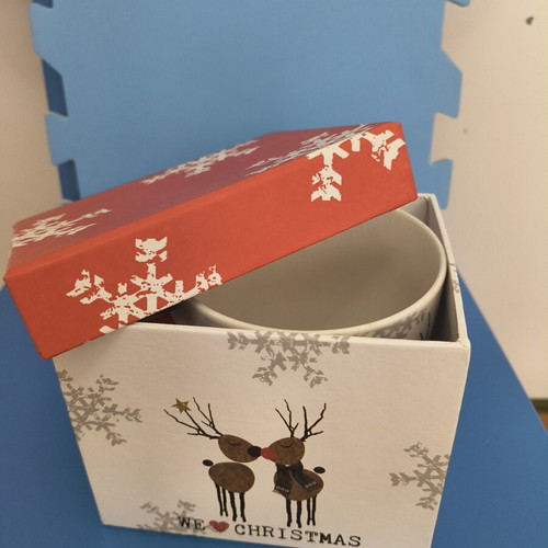 Christmas-themed mug with two reindeer