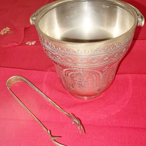 Silver-plated ice bucket like new with carved details and special handle