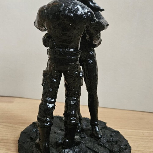 Handmade sculpture of embracing couple