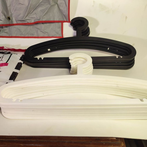 Set of 20 hangers and protective bags like new