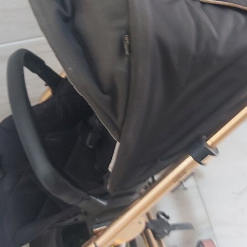 Mamas & Papas baby stroller with some wear on wheels and canopy
