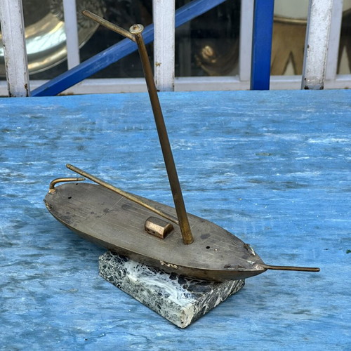 Vintage brass sailboat decoration on marble base, used