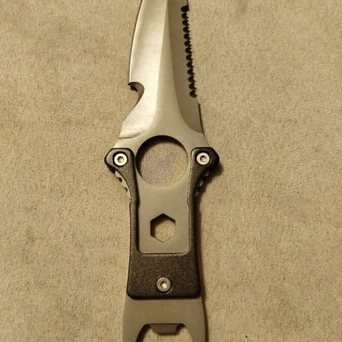 Stainless steel knife new with sheath and saw blade